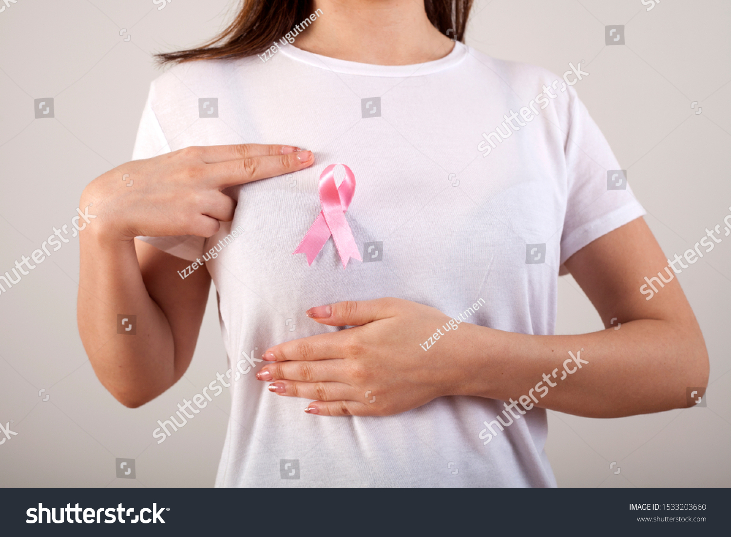 young woman checking her breast for breast cancer #1533203660
