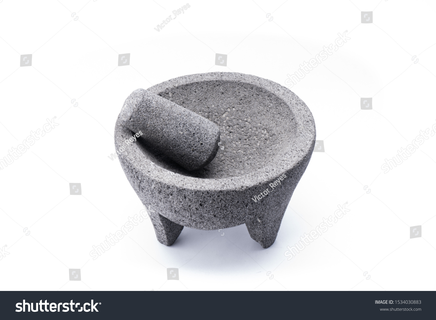 Stone molcajete used to grind vegetables and prepare typical Mexican foods #1534030883