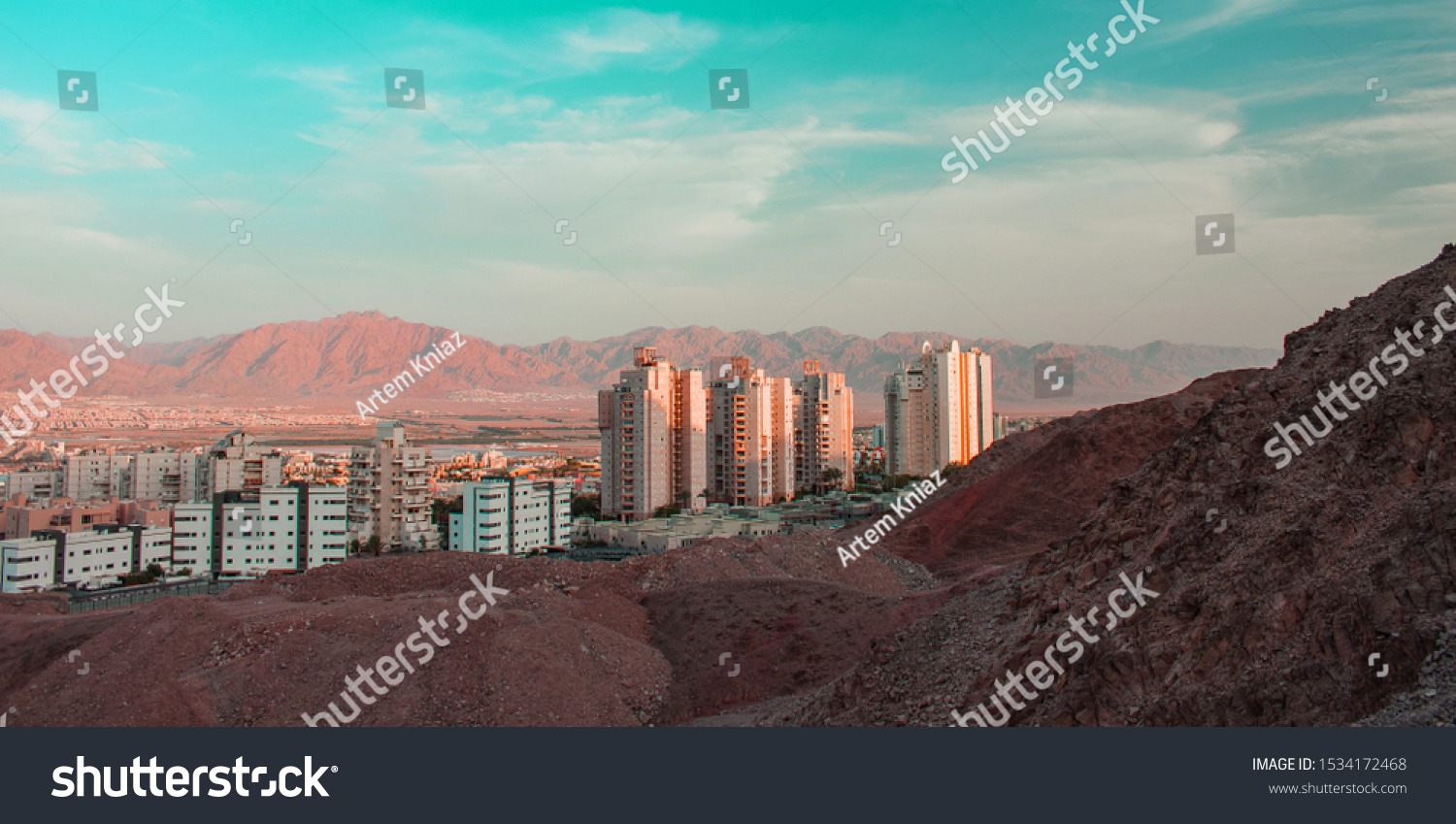 Gulf of Aqaba city living building from Middle East desert hills view point with blue sky and Jordanian mountain background  #1534172468