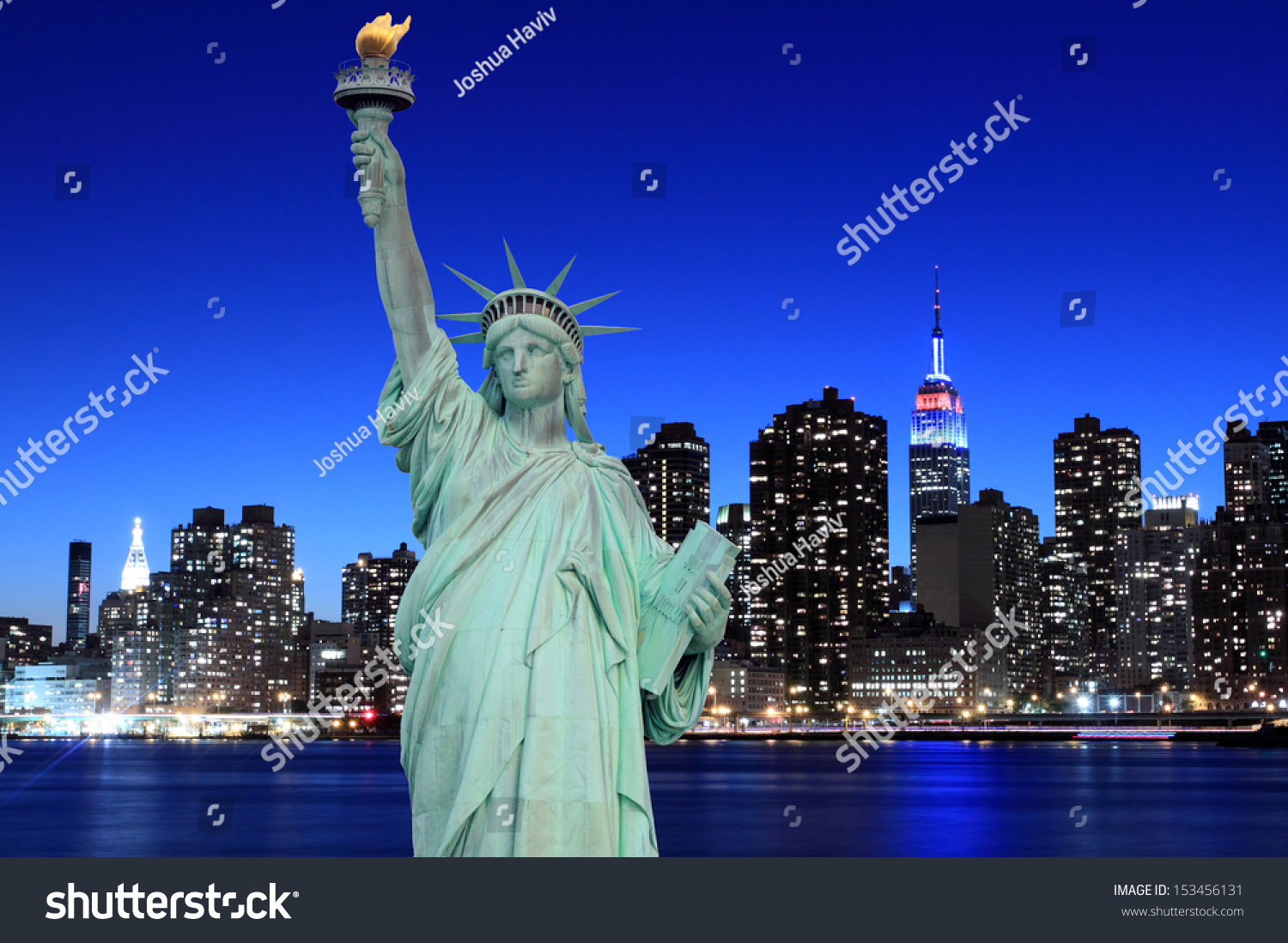 Midtown Manhattan Skyline and The Statue of Liberty at Night, New York City #153456131