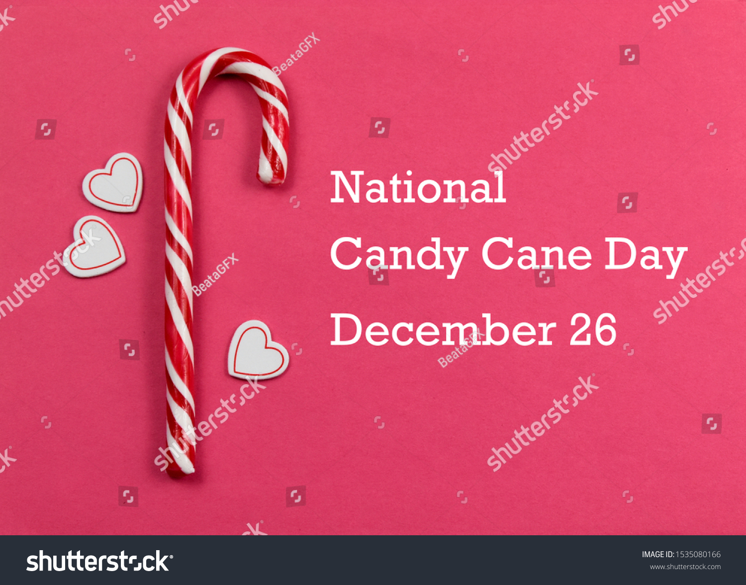 National Candy Cane Day images. Candy Cane with hearts on a pink background. Candy Cane Day Poster, December 26. Christmas candy cane stock images. Sweet Christmas symbol #1535080166
