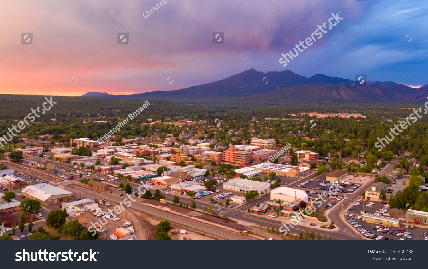 Blue and Orange color swirls around in the clouds at sunset over Flagstaff Arizona #1535400788