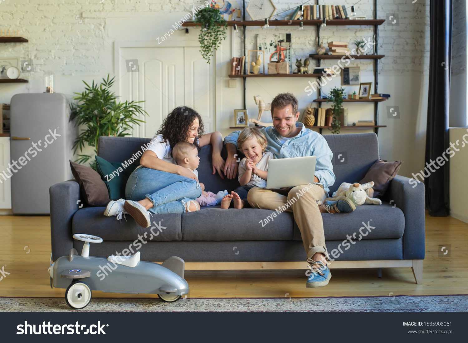Young beautiful happy family relaxing at home #1535908061