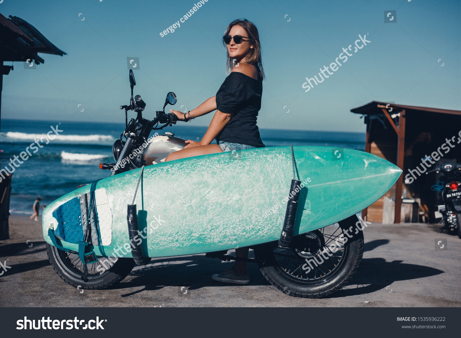Beauty woman using custom old motorcycle, outdoor hipster portrait,surfboard,brutal girl, sunglasses, hipsters in stylish clothing for a retro motorcycle on the street,beach, surfboard, longboard,Bali #1535936222