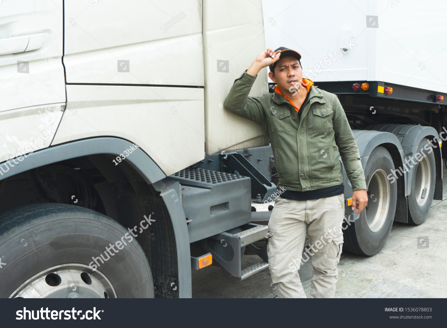 truck driver stands beside the semi-trailer truck, freight industry truck transport. #1536078803