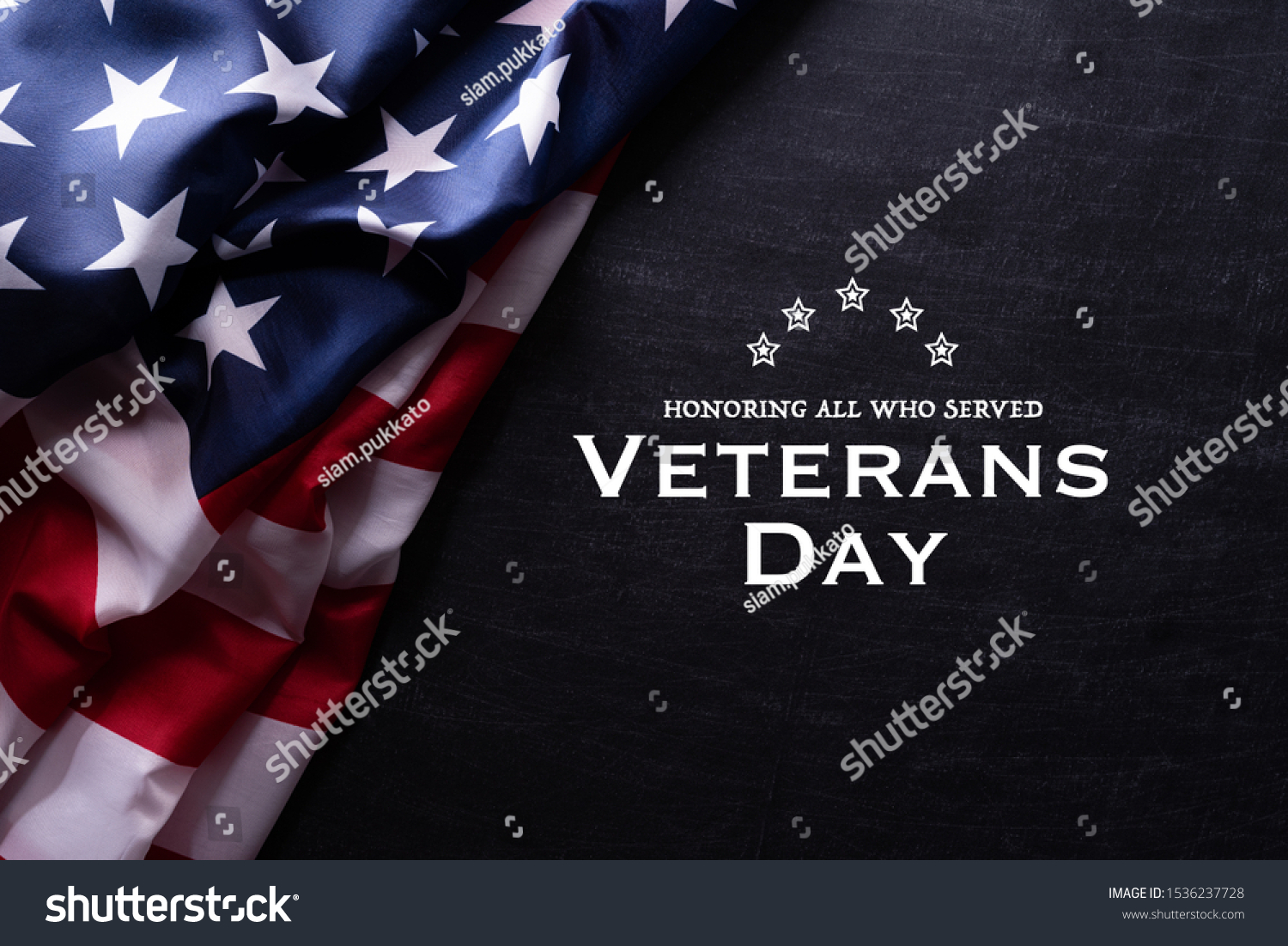 Happy Veterans Day. American flags with the text thank you veterans against a blackboard background. November 11. #1536237728
