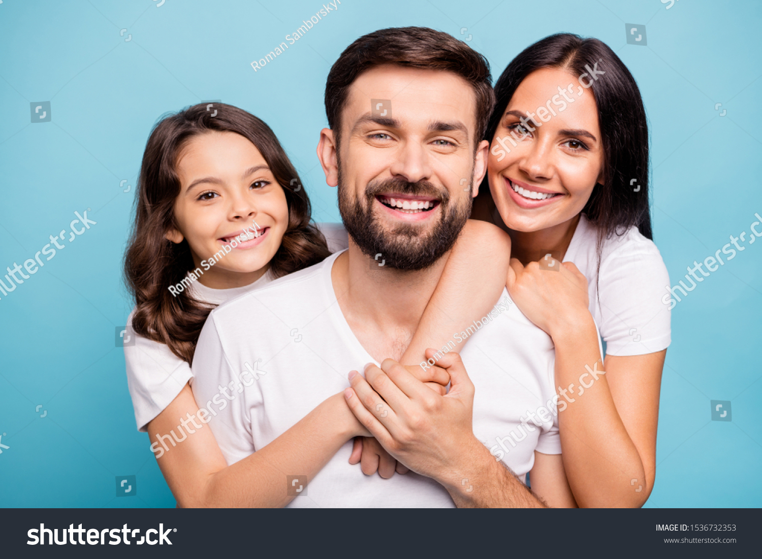 Close up photo of cheerful content three people with cute schoolkid hug lean shoulder cuddle piggyback enjoy weekends holidays wear white trendy t-shirt isolated over blue color background #1536732353