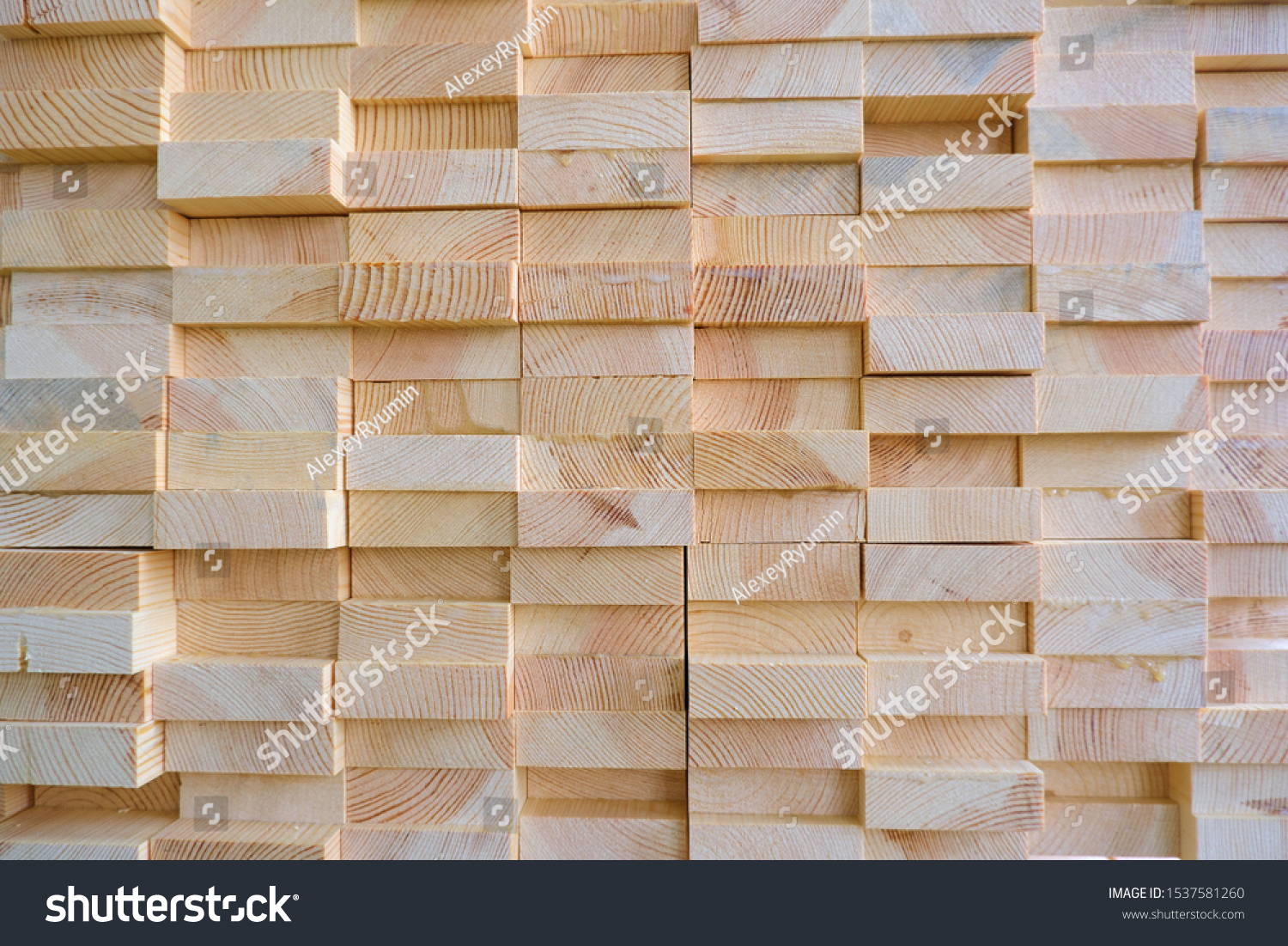 Stack of three-layer wooden glued laminated timber beams from pine finger joint spliced boards #1537581260
