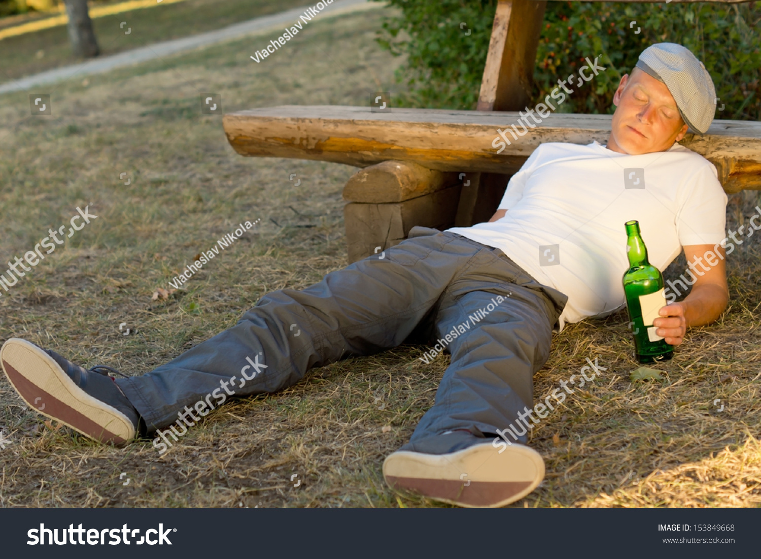 Royalty Free Drunk Man Fallen Asleep On The Ground 153849668 Stock