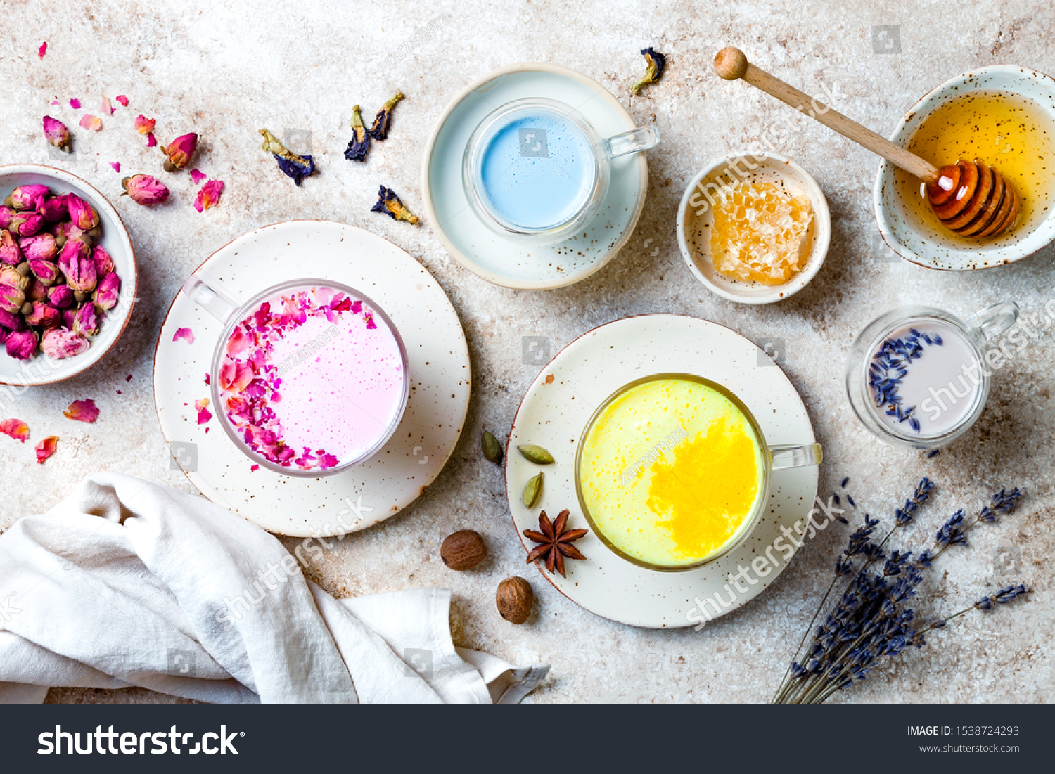 Variety of Moon Milk for a better sleep. Turmeric golden milk, pink rose milk, blue butterfly pea and lavender moon milk. Trendy relaxing bedtime drink #1538724293