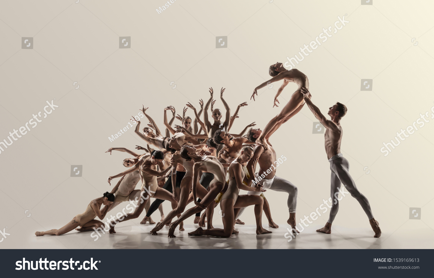 Support. Group of modern ballet dancers. Contemporary art. Young flexible athletic men and women in tights. Negative space. Concept of dance grace, inspiration, creativity. Made of shots of 11 models. #1539169613