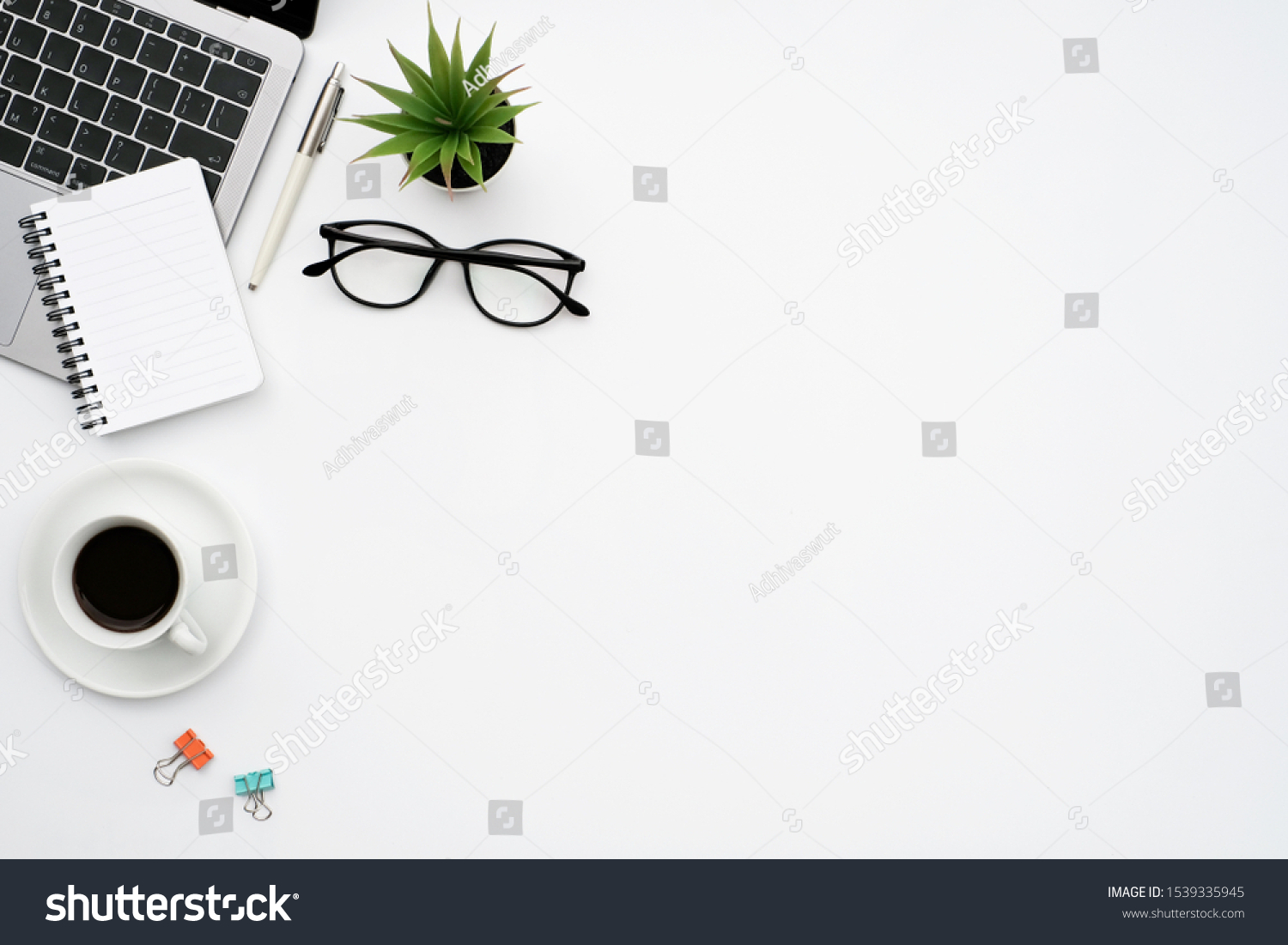 Work space office business and finance concept on white table desk background with laptop computer and coffee cup, green plant and glasses, Top view with copy space, flat lay #1539335945