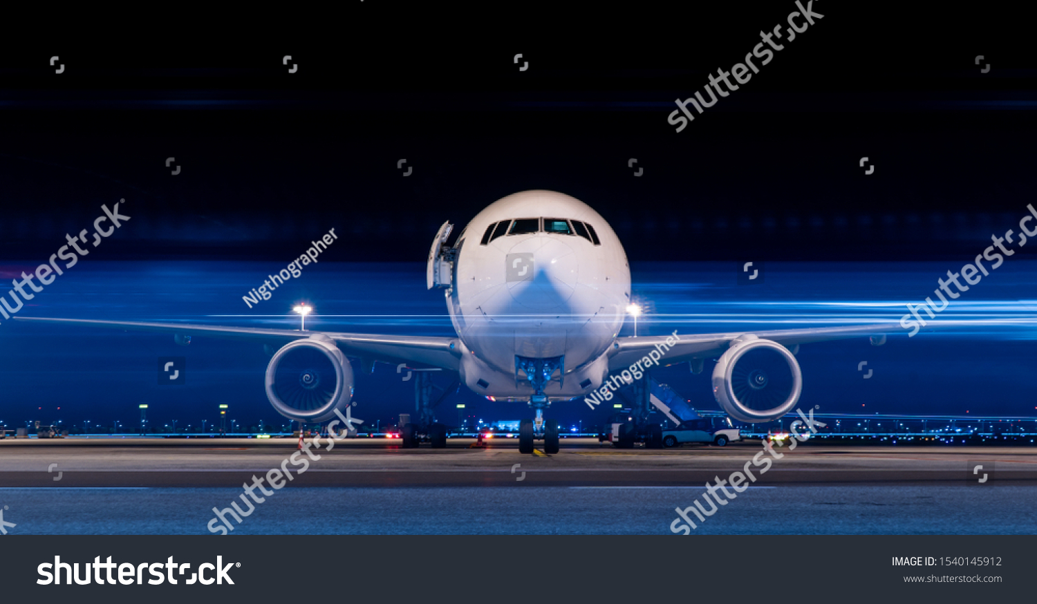 Parked aircraft in night with moving light #1540145912