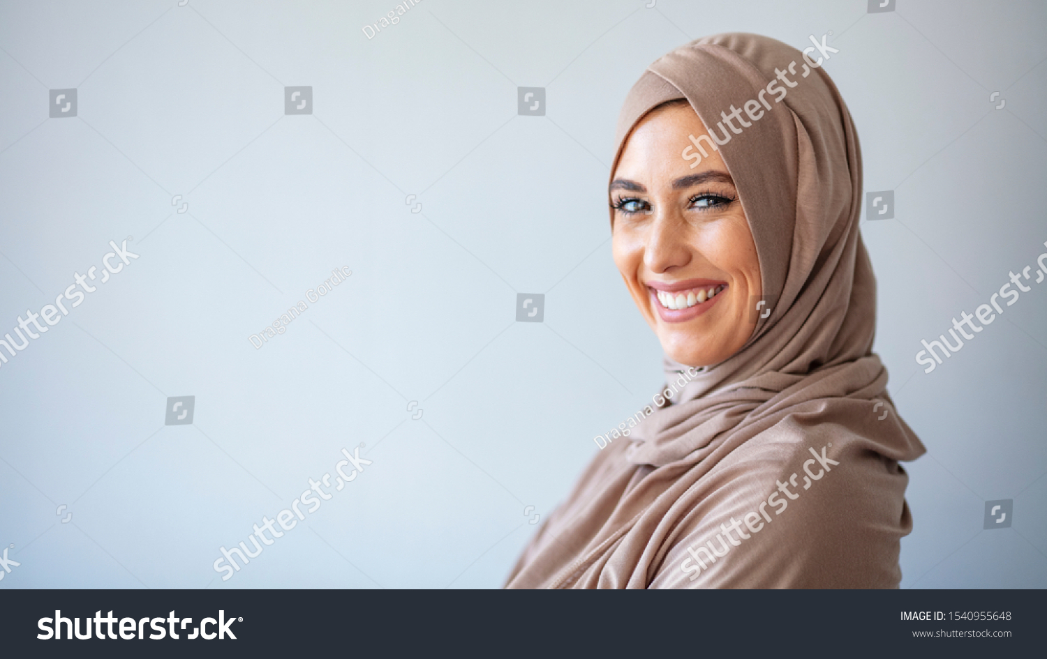 Young asian muslim woman in head scarf smile. Beautiful middle eastern woman wearing abaya. Arabian woman with happy smile. Strict formal outfit and elegant appearance. Islamic fashion. #1540955648