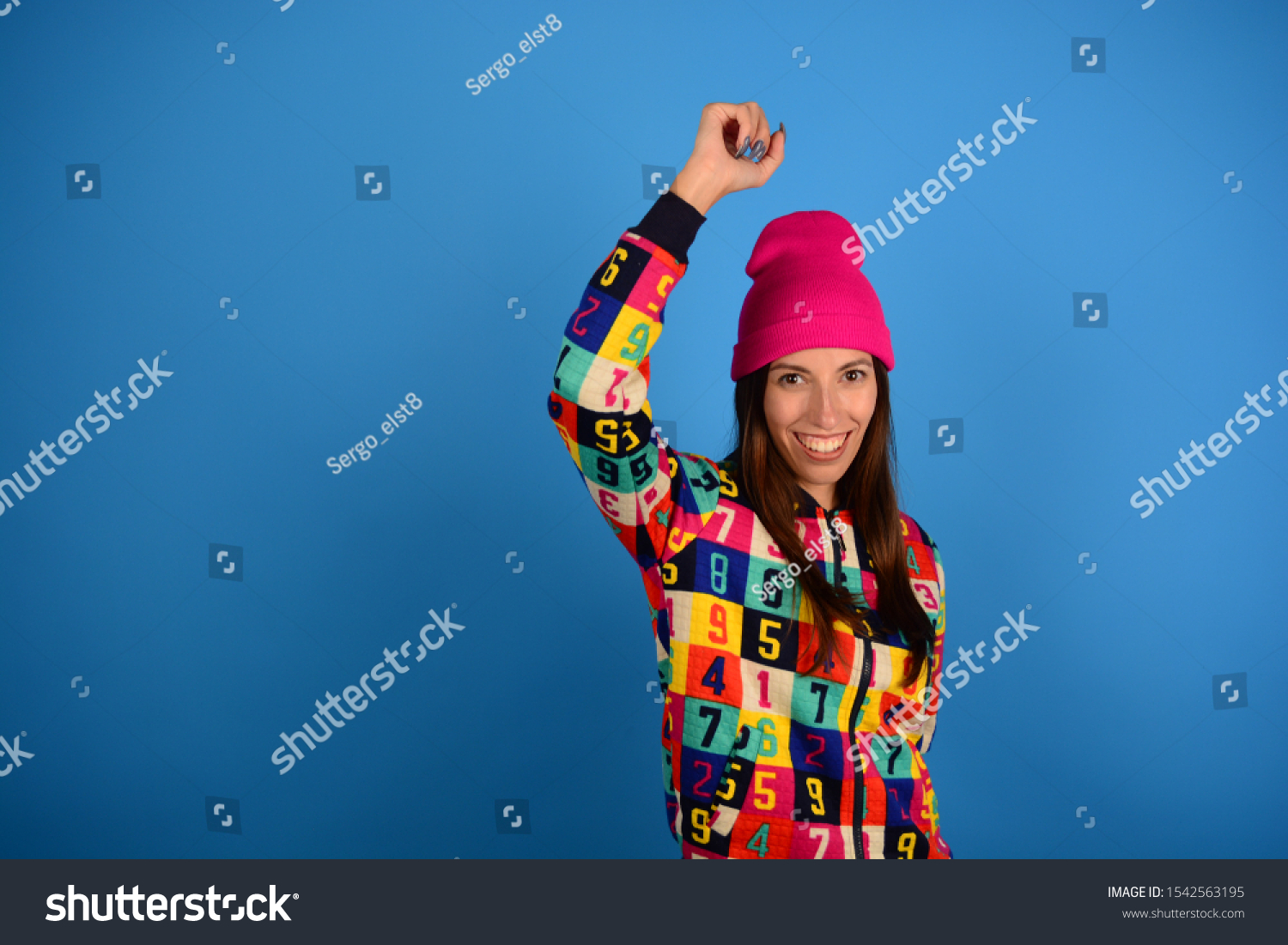 woman joyful young cheerful joy on blue background fashion style #1542563195