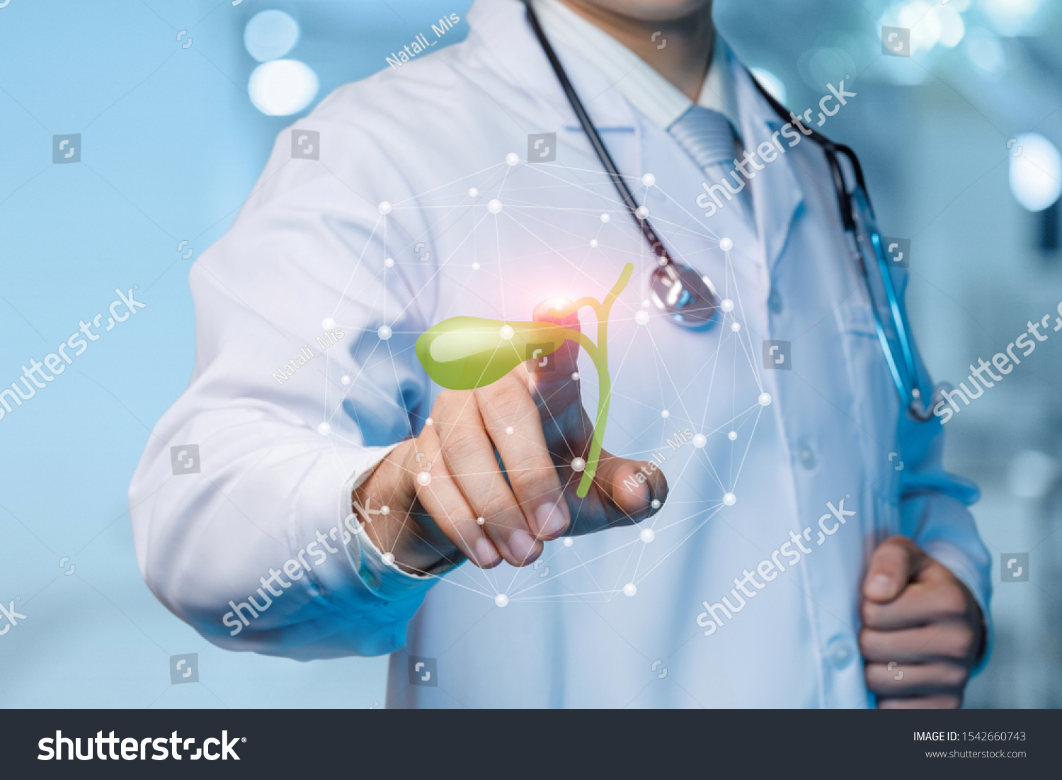 The concept of treatment of the gallbladder. The doctor clicks on the gall bladder on the blurred background. #1542660743
