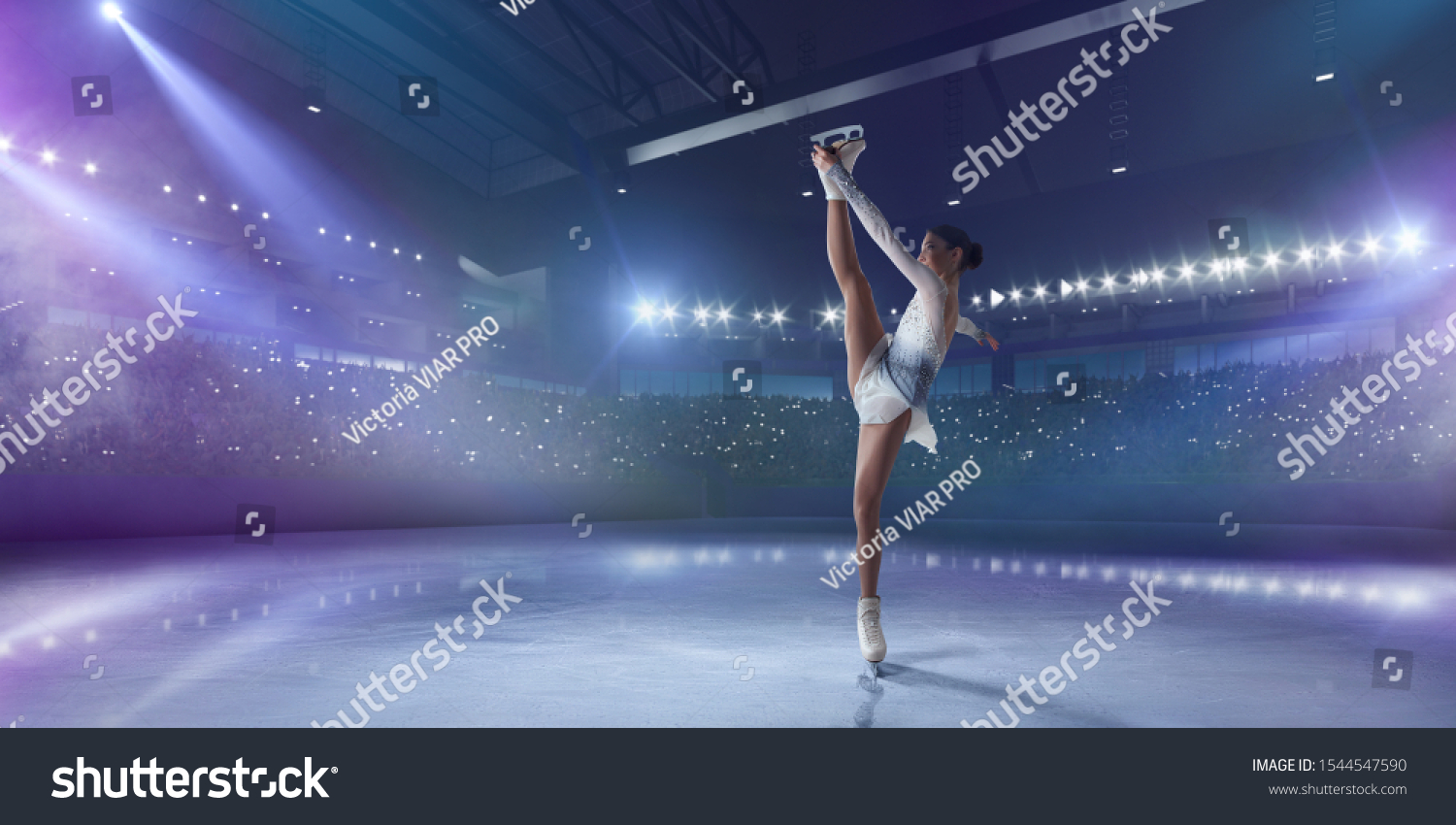 Figure skating girl in ice arena. #1544547590