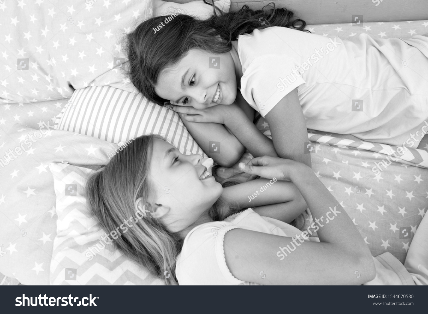 One of the luckiest things is to have a happy childhood. Adorable little children having afternoon nap in bedroom. Enjoying happy childhood. Childhood years. Childhood and girlhood. #1544670530