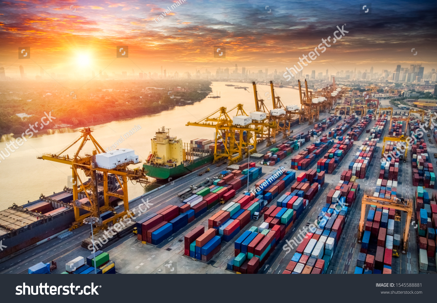 Aerial top view container cargo ship in import - export business logistic and transportation of Container Cargo ship with working crane bridge in shipping #1545588881