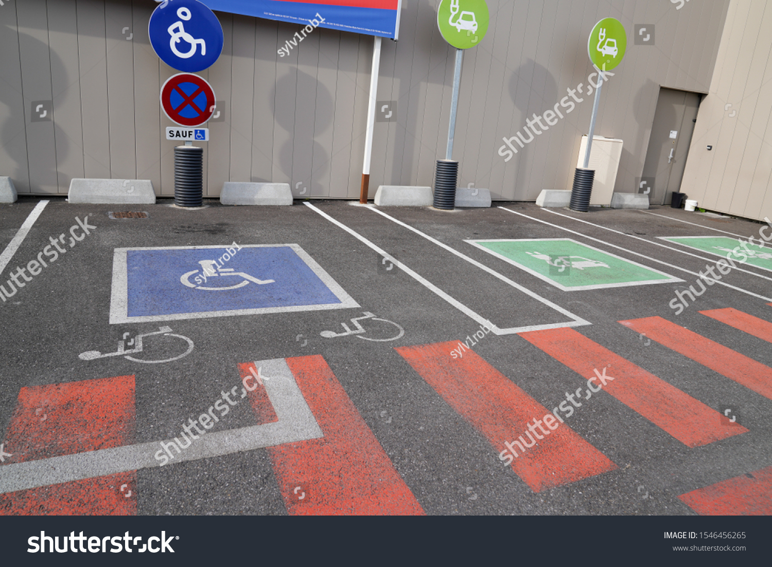 Handicapped parking car only electric vehicle ve pictogram on street #1546456265