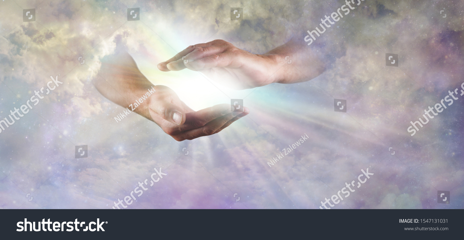 Let there Be Light Divine Concept -  God's hands emerging from beautiful clouds, cupped, with rainbow colored bright white star burst of light between and copy space
 #1547131031