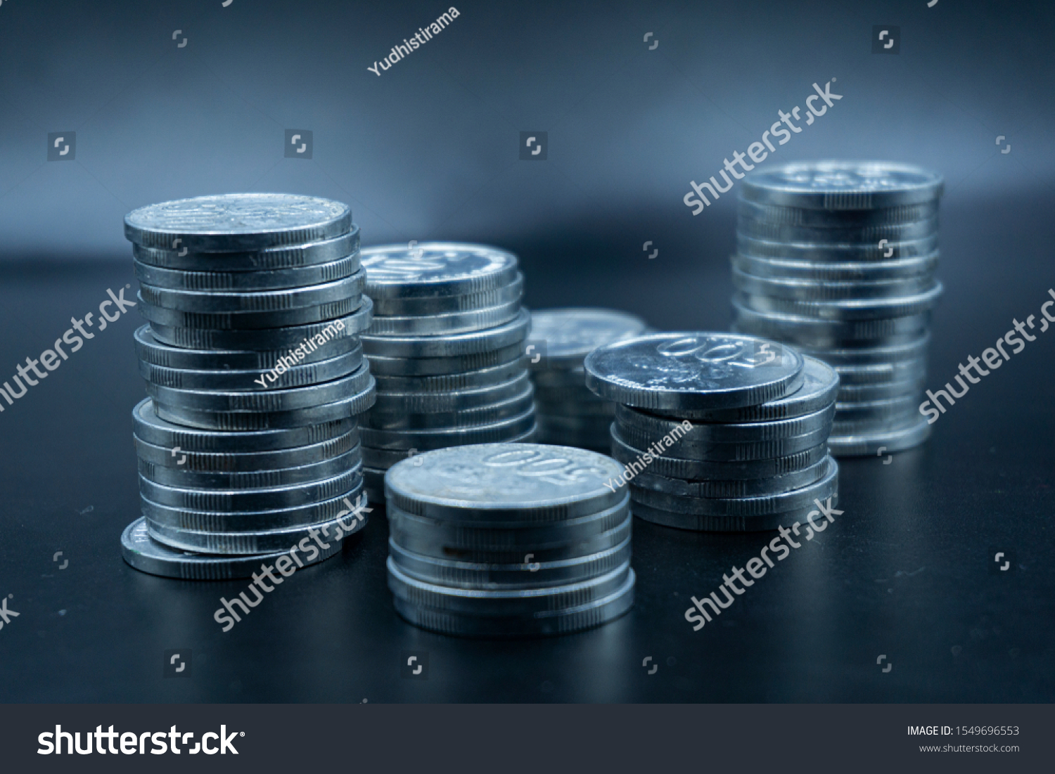 Close up of coins to stack of coins, Business Growth concept, There is money coins to stack of coins. Financial risk. #1549696553