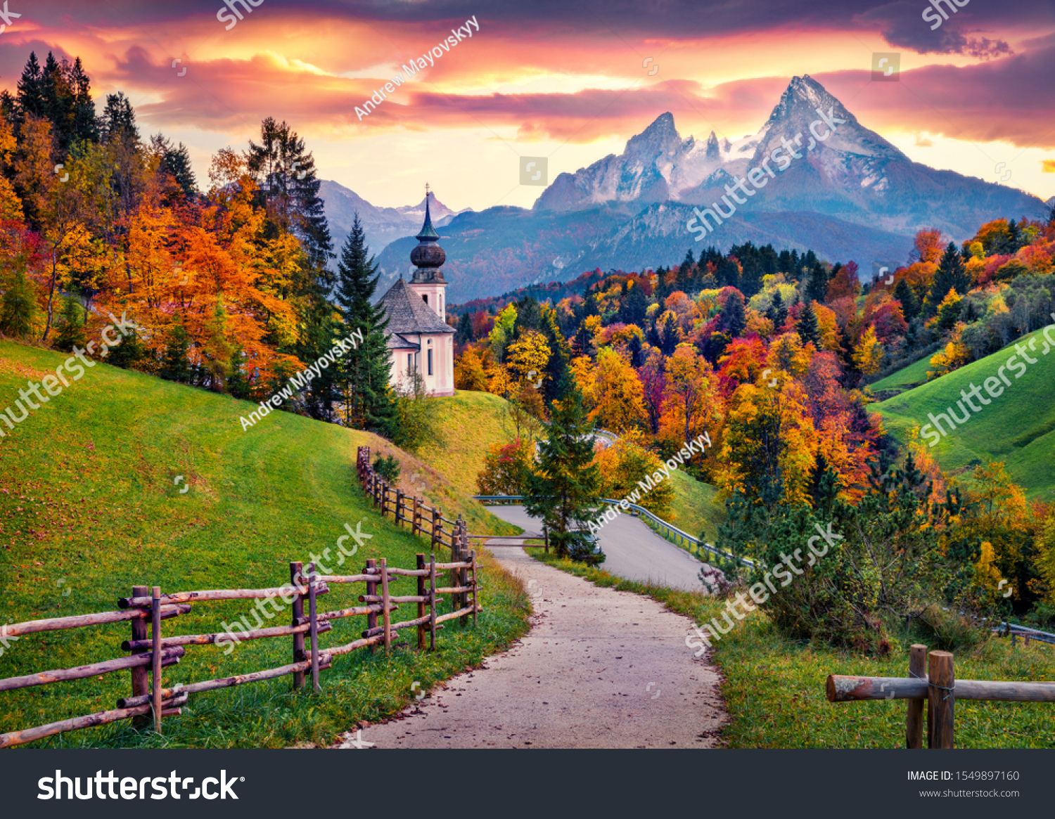 Iconic picture of Bavaria with Maria Gern church with Hochkalter peak on background. Fantastic autumn sunrise in Alps. Superb evening landscape of Germany countryside. Traveling concept background. #1549897160