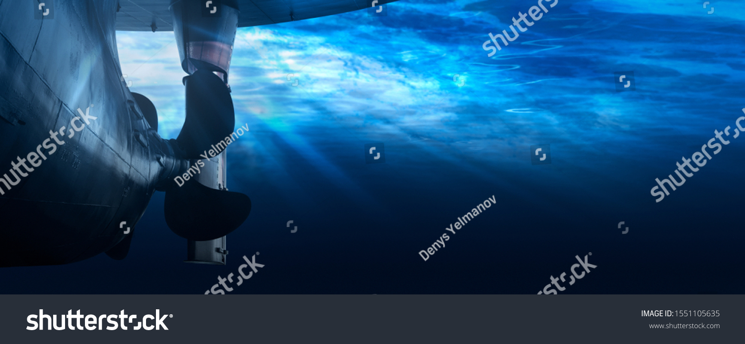 Propeller and rudder of big ship underway from underwater. Close up image detail of ship. Transportation industry. Freight transportation. Ship repair, underwater survey and shipping business concept #1551105635