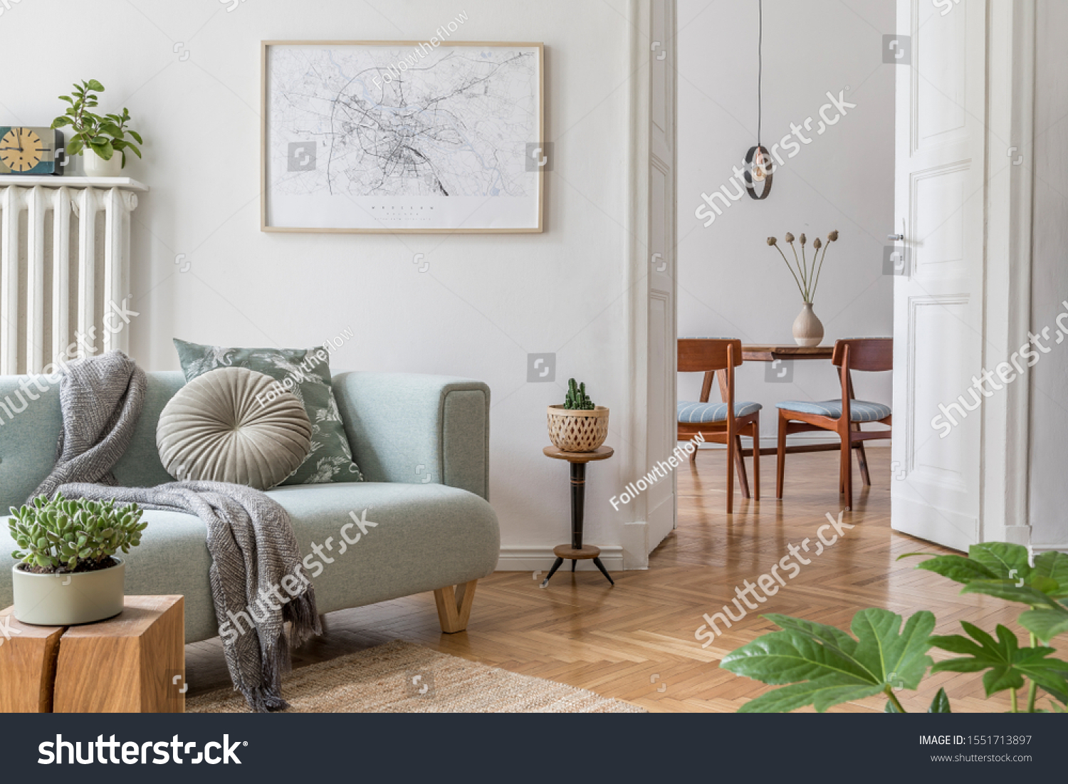 Stylish scandinavian living room and dining room with design mint sofa, mock up poster map, plants and elegant personal accessories. Modern home decor. Open space. Template. Ready to use.  #1551713897