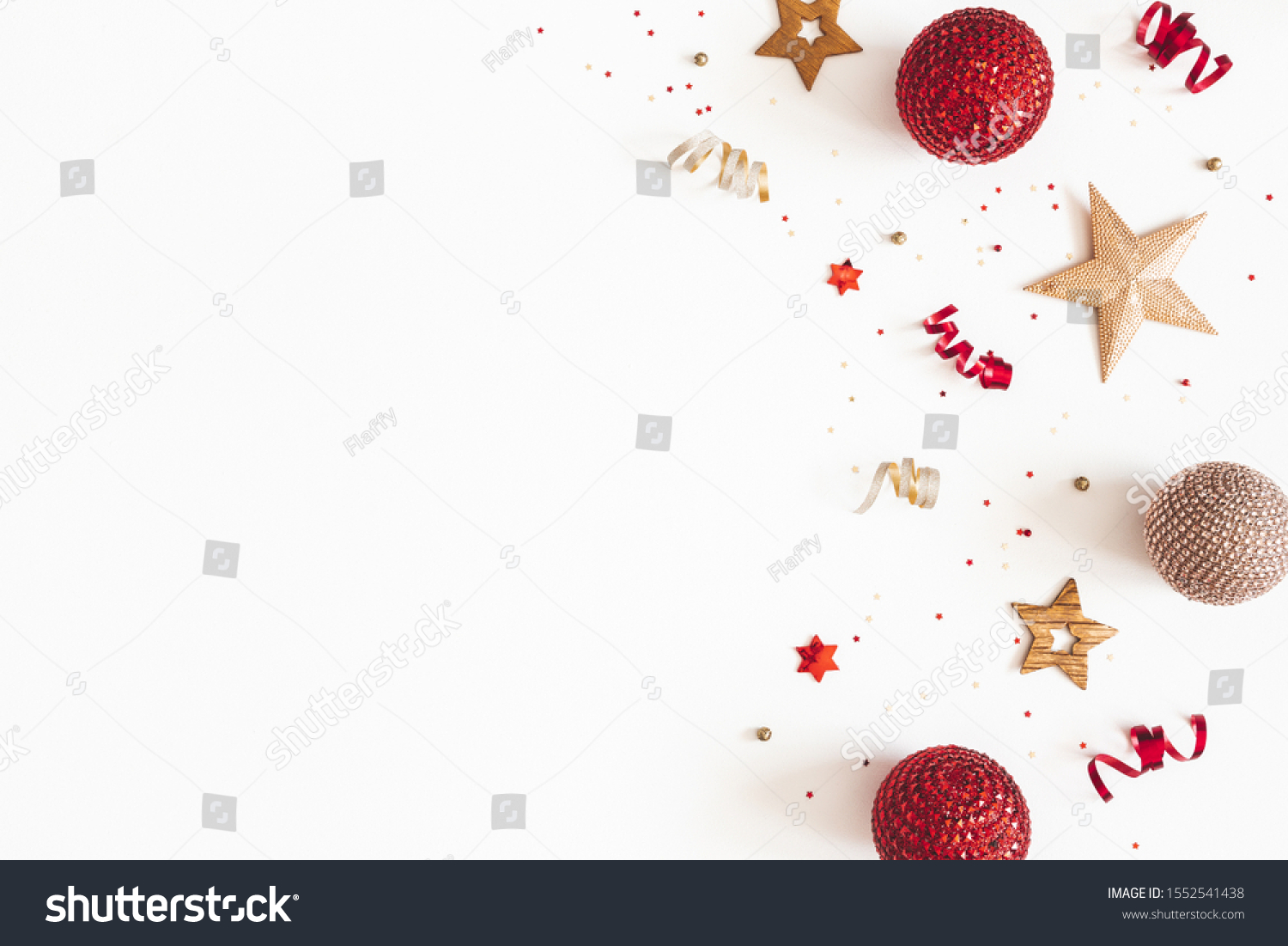 Christmas composition. Red and golden decorations on white background. Christmas, winter, new year concept. Flat lay, top view, copy space #1552541438