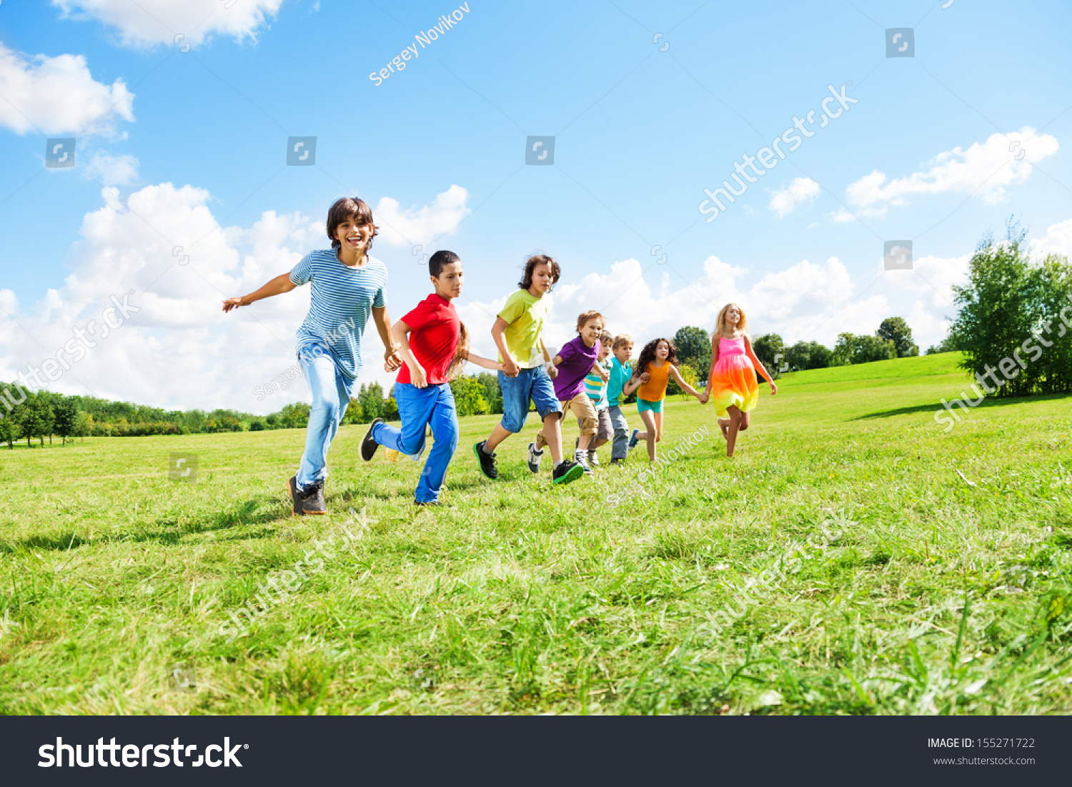 Large group of happy kids, boys and girls running in the park on sunny summer day in casual clothes #155271722