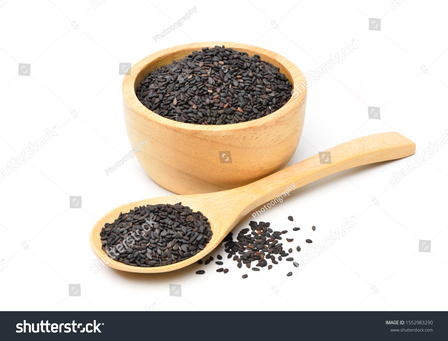 Black sesame seeds in wooden bowl and wooden spoon isolated on white background. #1552983290