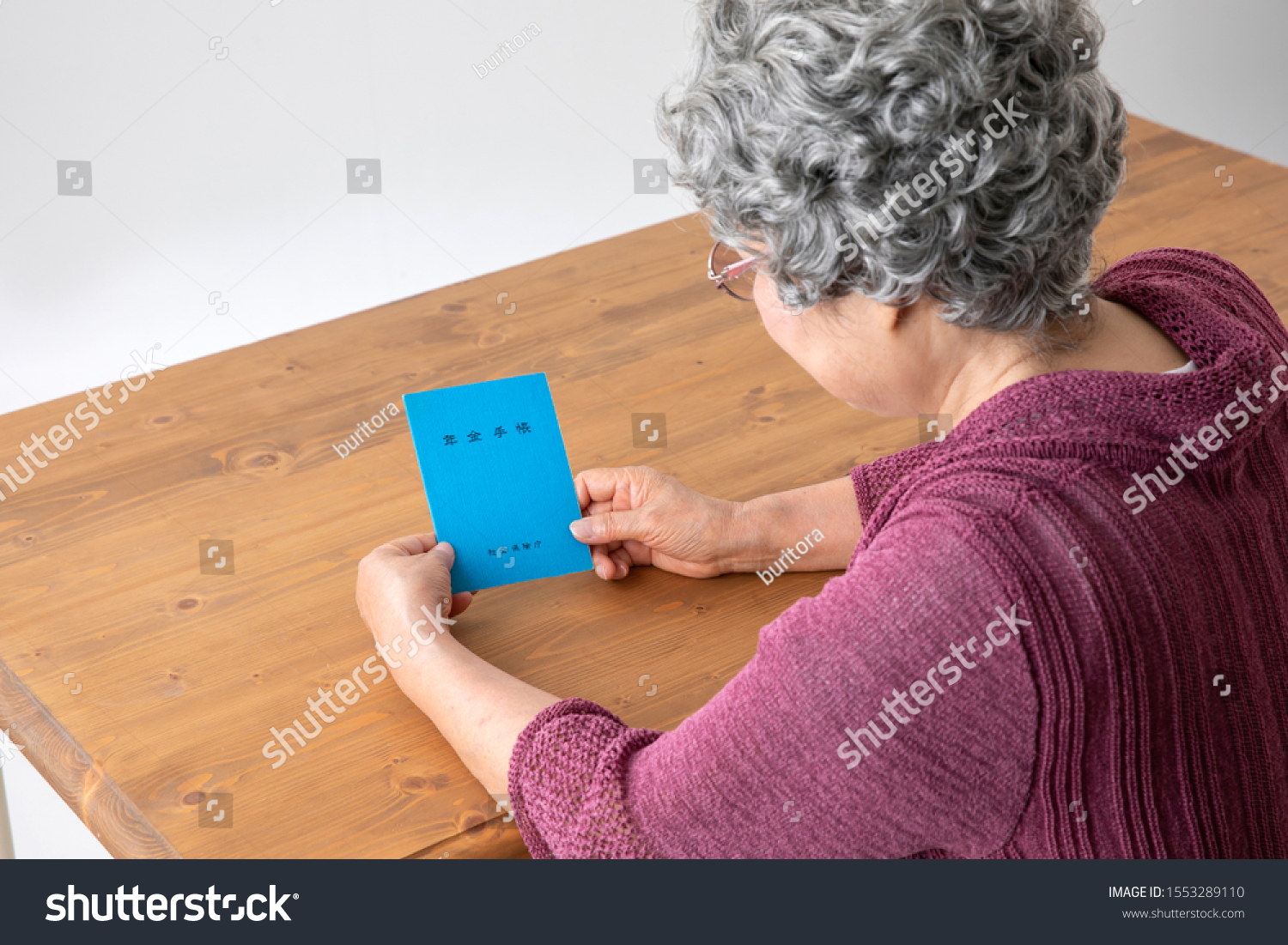 Old woman having a pension notebook(Japanese pension notebook) #1553289110