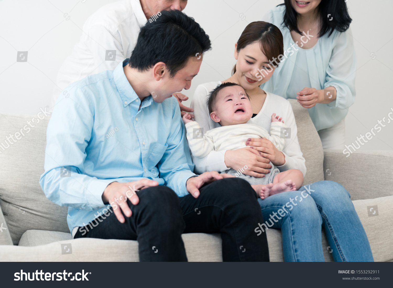 A baby and family image #1553292911