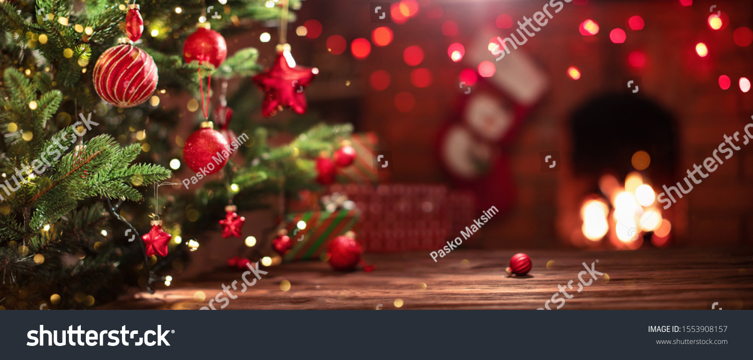 Christmas Tree with Decorations Near a Fireplace with Lights #1553908157