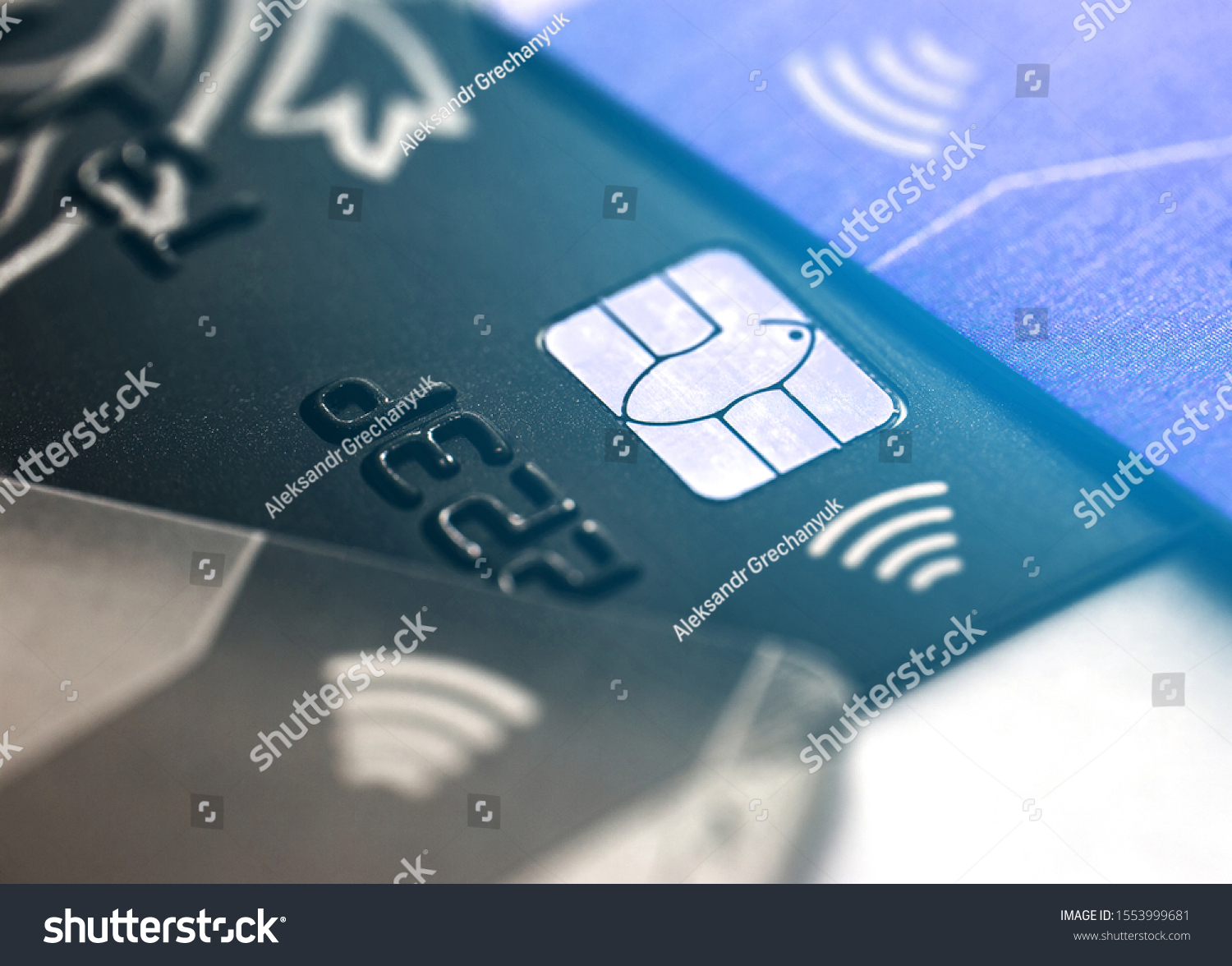Electronic contactless credit card with selective focus microchip. Macro of a credit card. #1553999681