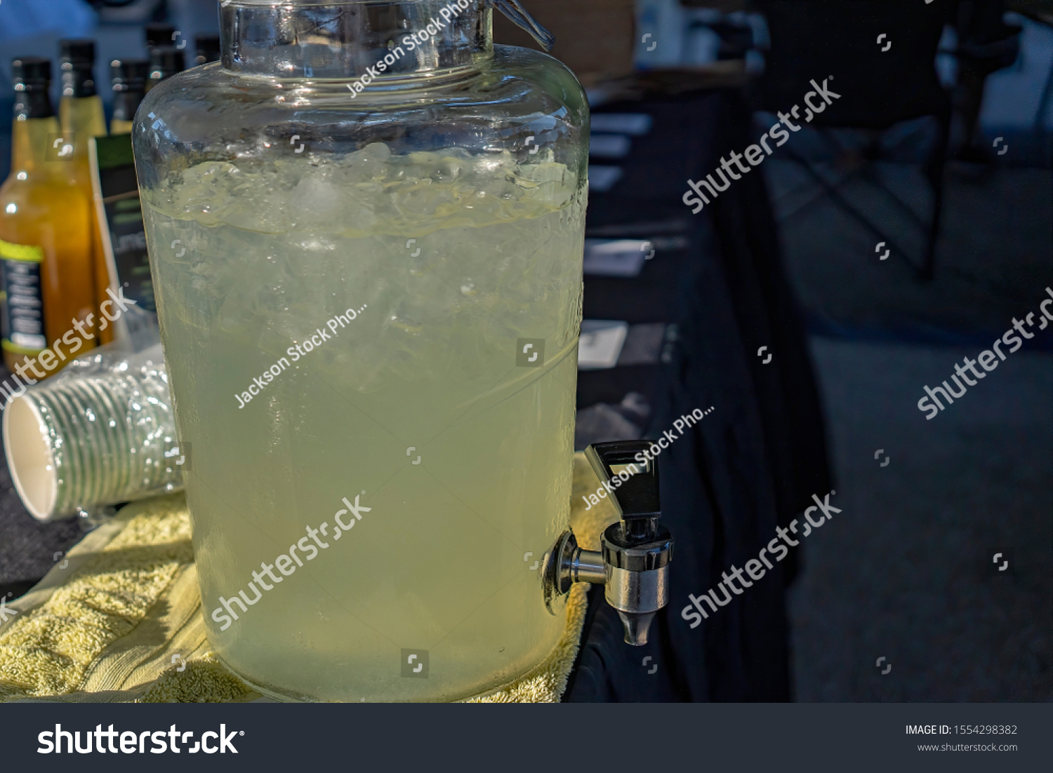 Cold refreshing lemonade for sale at a market stall #1554298382