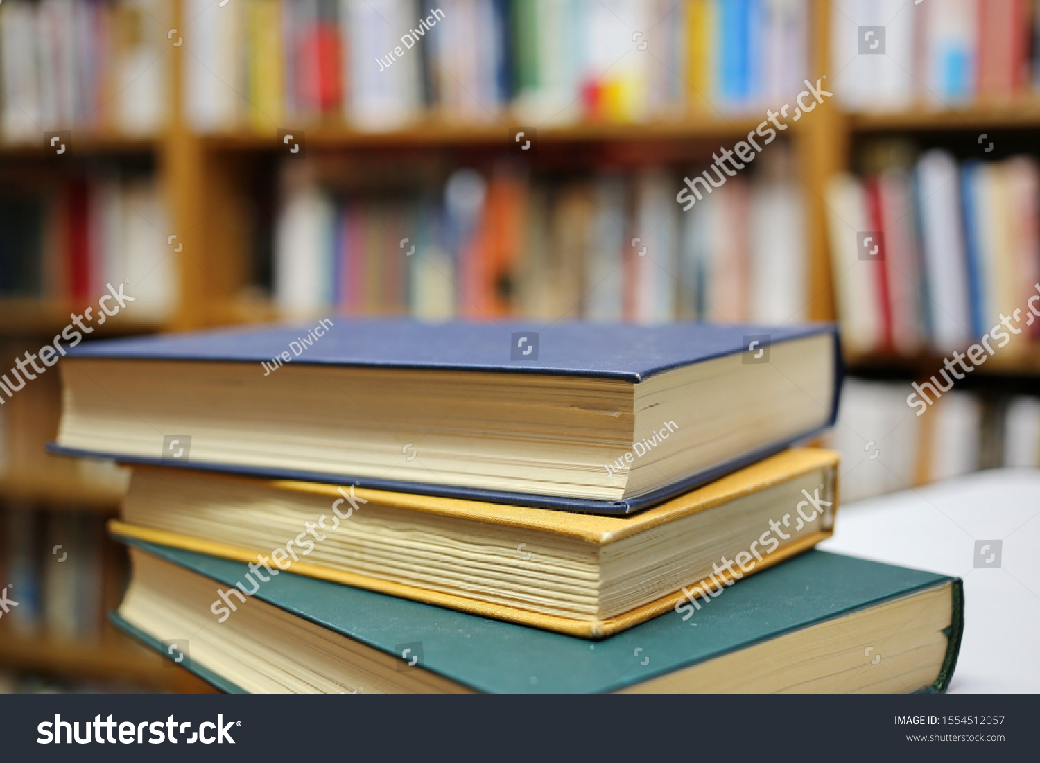 Stack of books in public library #1554512057