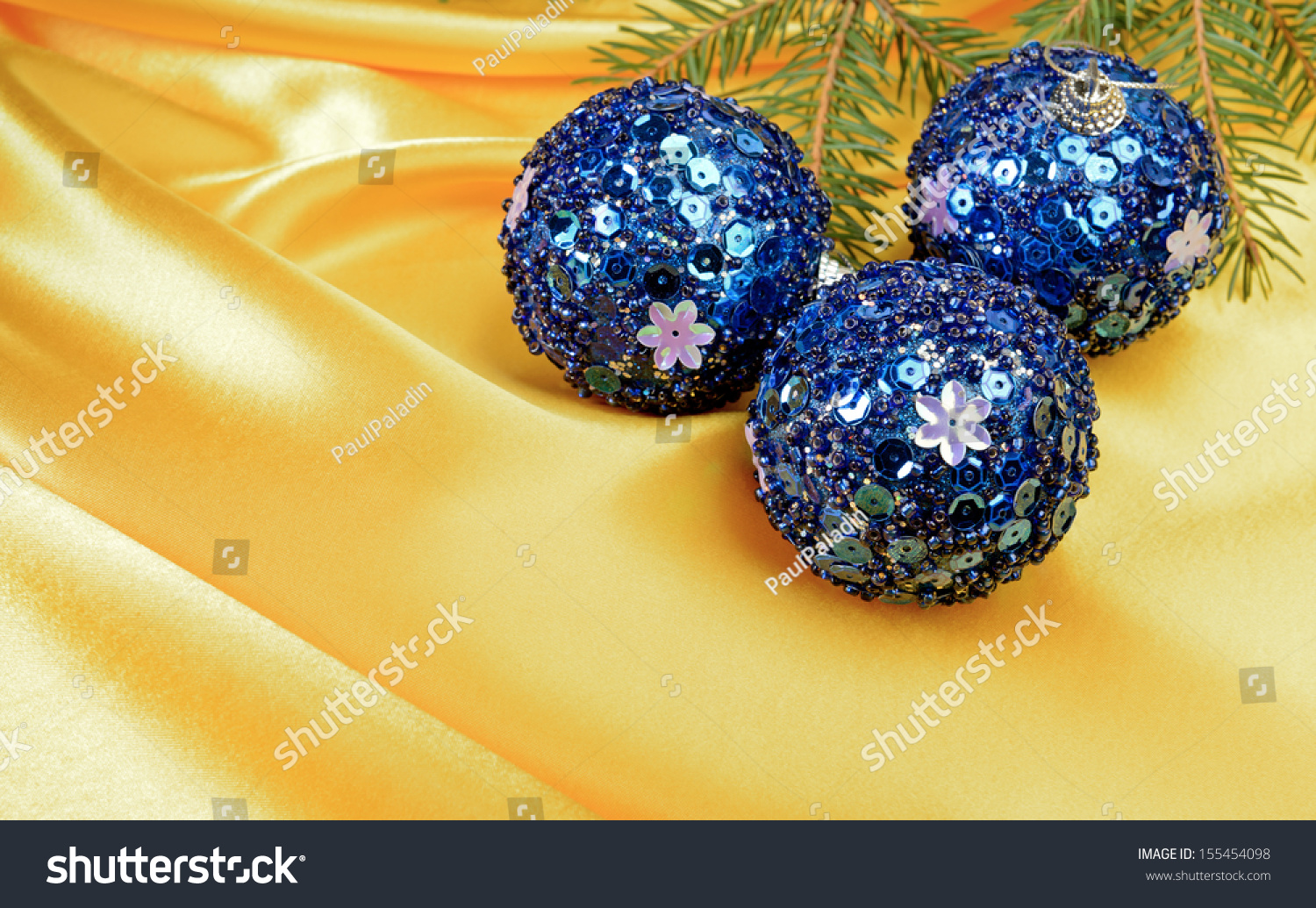 Christmas ball and pine tree branch decoration on yellow silk #155454098