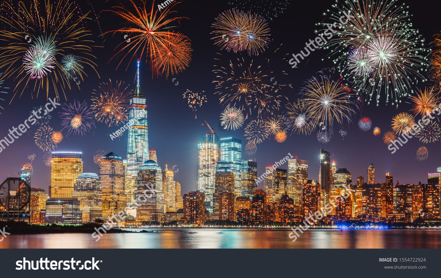 New Years Eve with colorful Fireworks over New York City skyline long exposure with dark blue-purple sky, orange city light glow and reflections in the river #1554722924