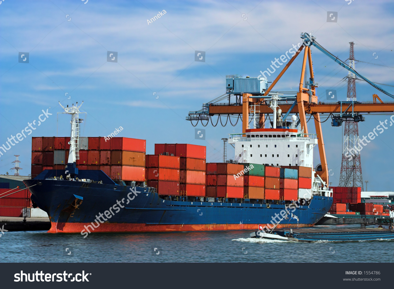 Large container ship in a dock at Antwerp harbor (logos and brandnames systematically removed) #1554786