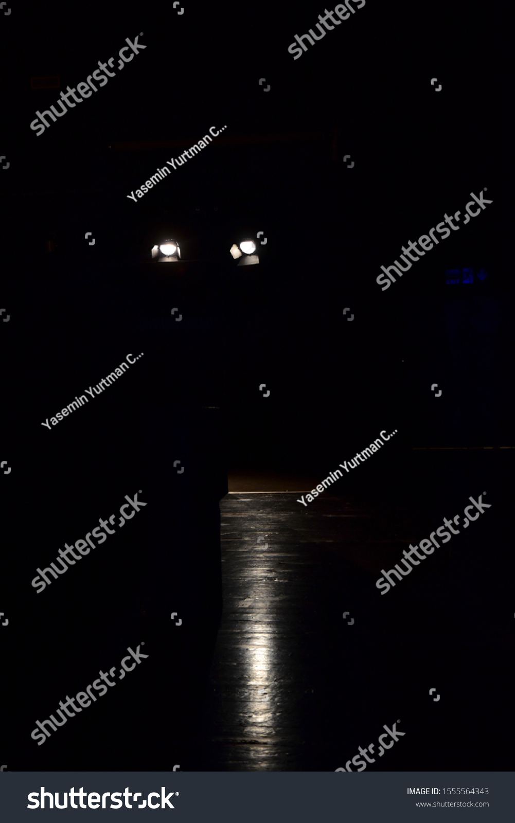 Spotlights on dark podium. Catwalk stage spotlights #1555564343