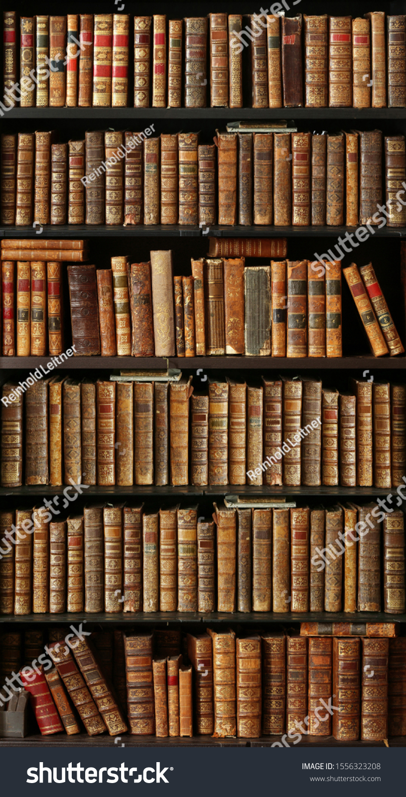 old books on wooden shelf #1556323208