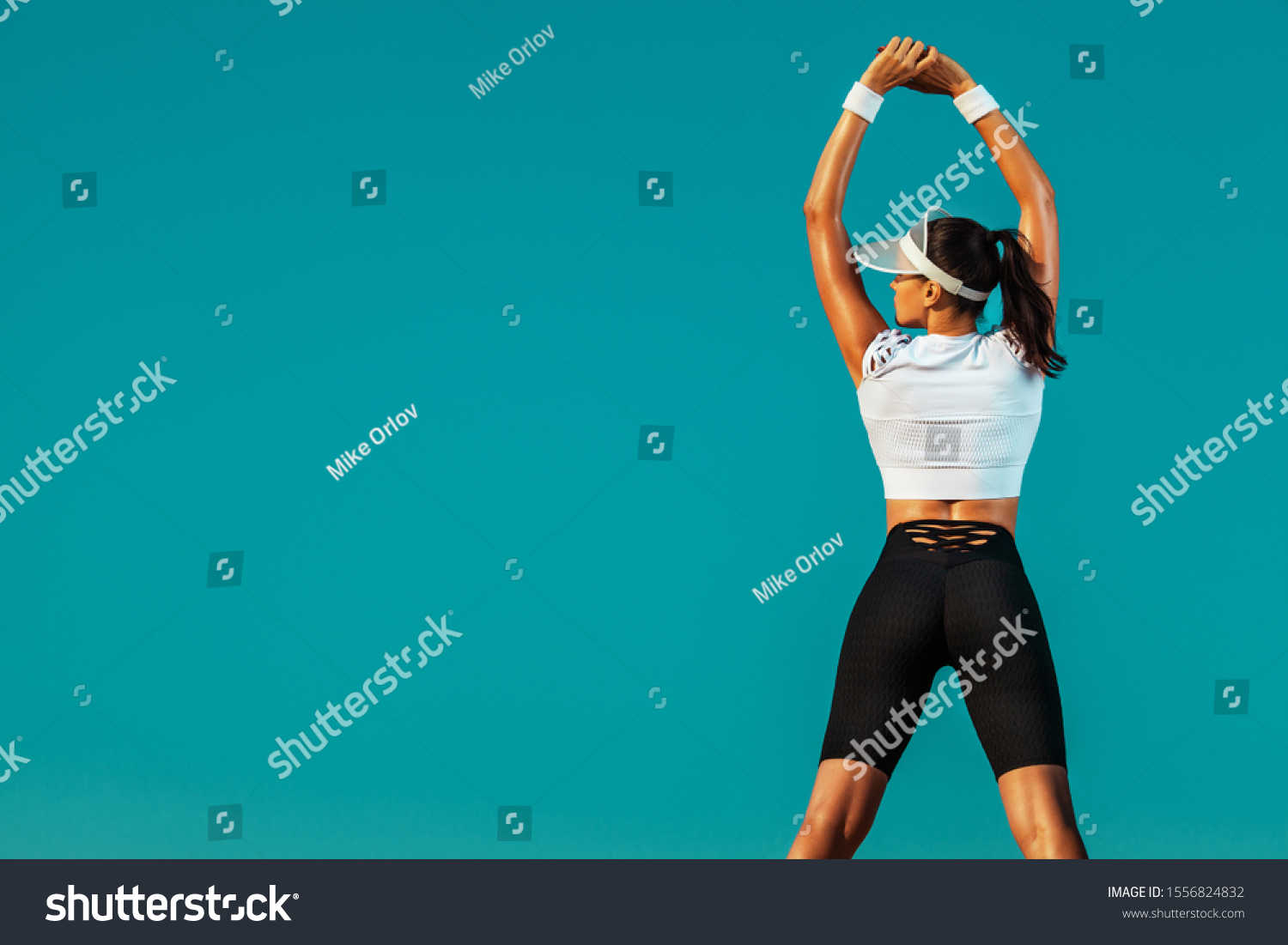 Sporty and fit young woman athlete doing yoga training on the sky background. The concept of a healthy lifestyle and sport. Individual sports recreation. #1556824832