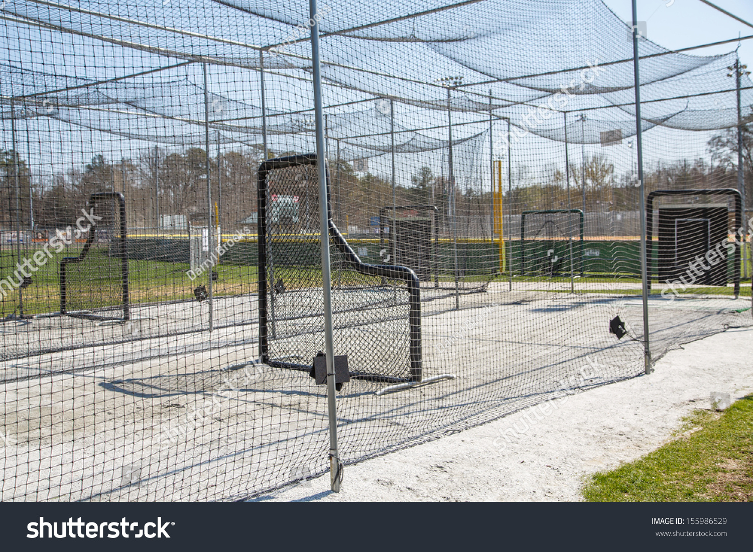 Chain link batting cages in a public baseball park #155986529