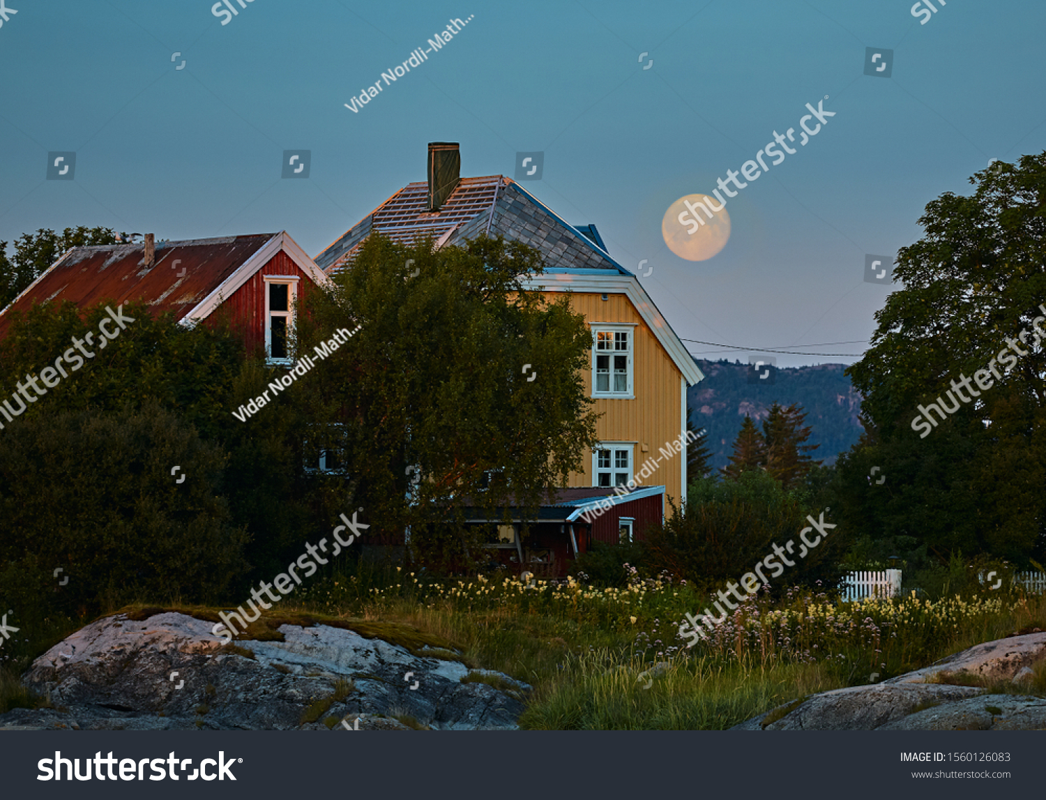 Full Moon over House in rural Norway #1560126083