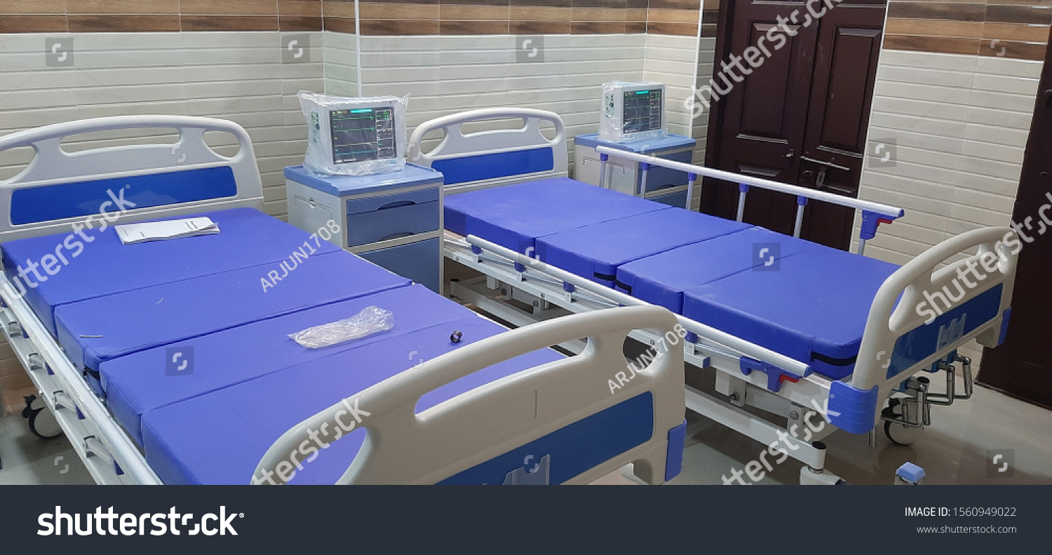 hospital beds, with bed side lockers, and patient monitor's #1560949022