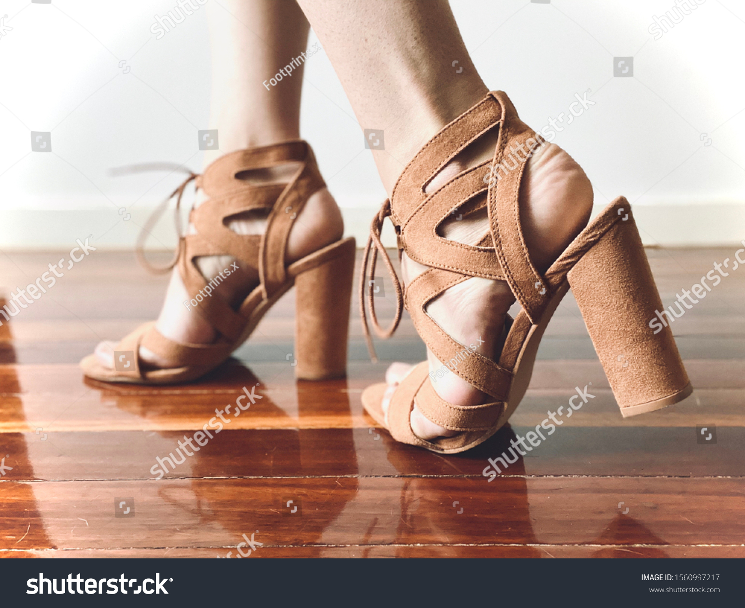 A brown high heeled shoe #1560997217