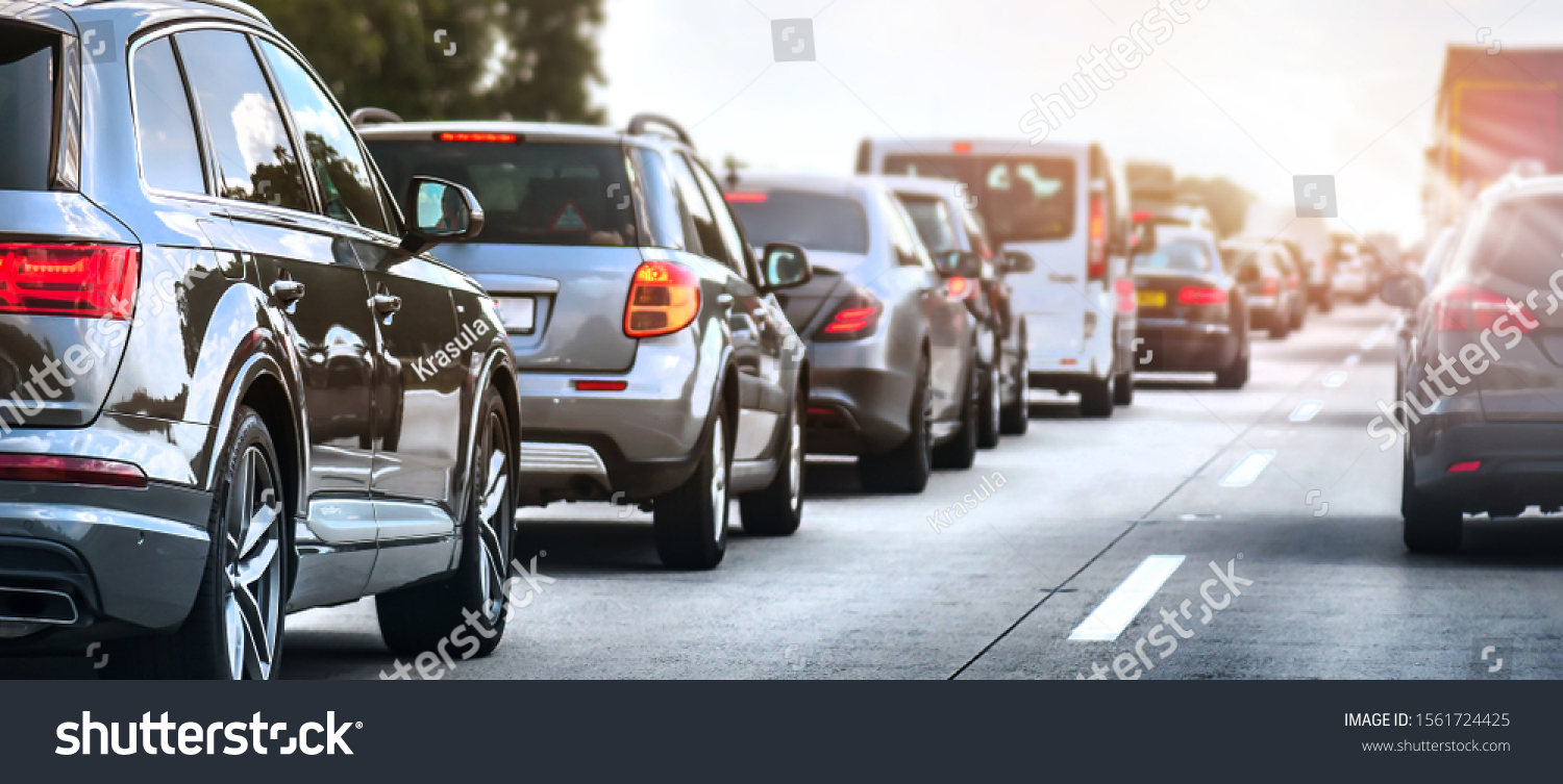 Car rush hours city street. Cars on highway in traffic jam #1561724425