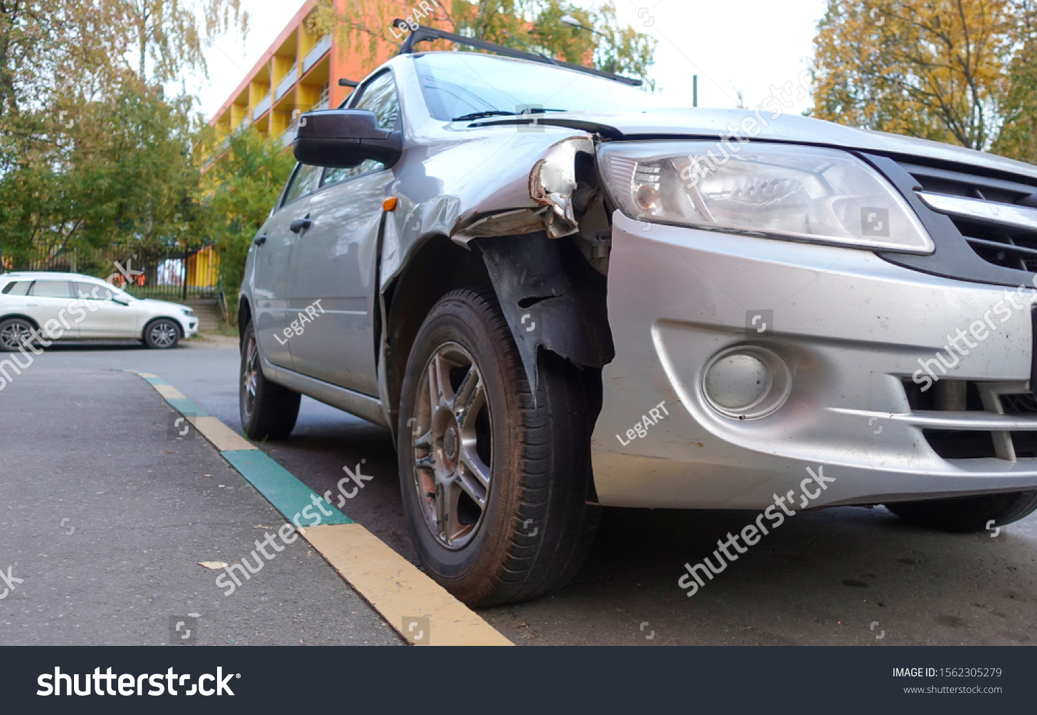 Broken passenger car close-up. Accident, car repair. #1562305279